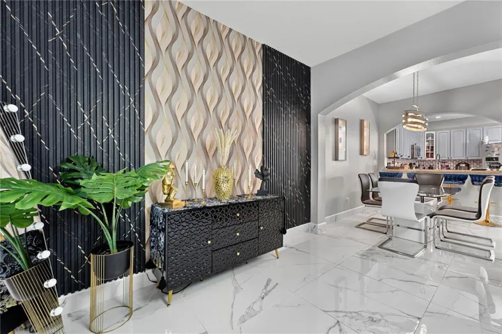 Dining area with decorative accent wall