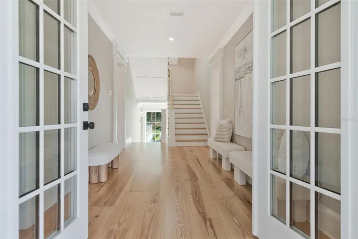 Welcoming French doors on floors one and two