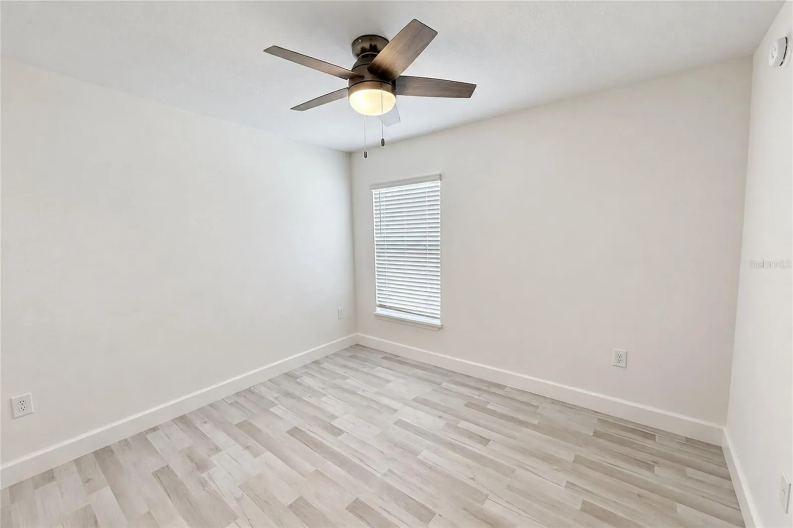 SECOND BEDROOM VIEW. CEILING FAN INCLUDED.