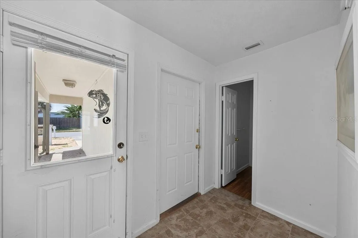 Unit 845 foyer and view of half bath