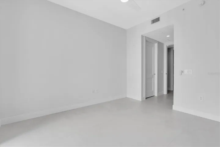 Generous guest room with modern detailing.