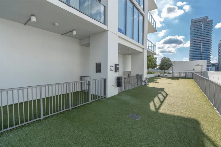Shaded outdoor lounge with plush seating.