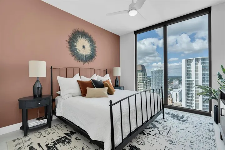 Spacious bedroom suite with high ceilings.