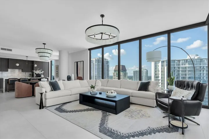 Elevated living area featuring floor-to-ceiling glass.