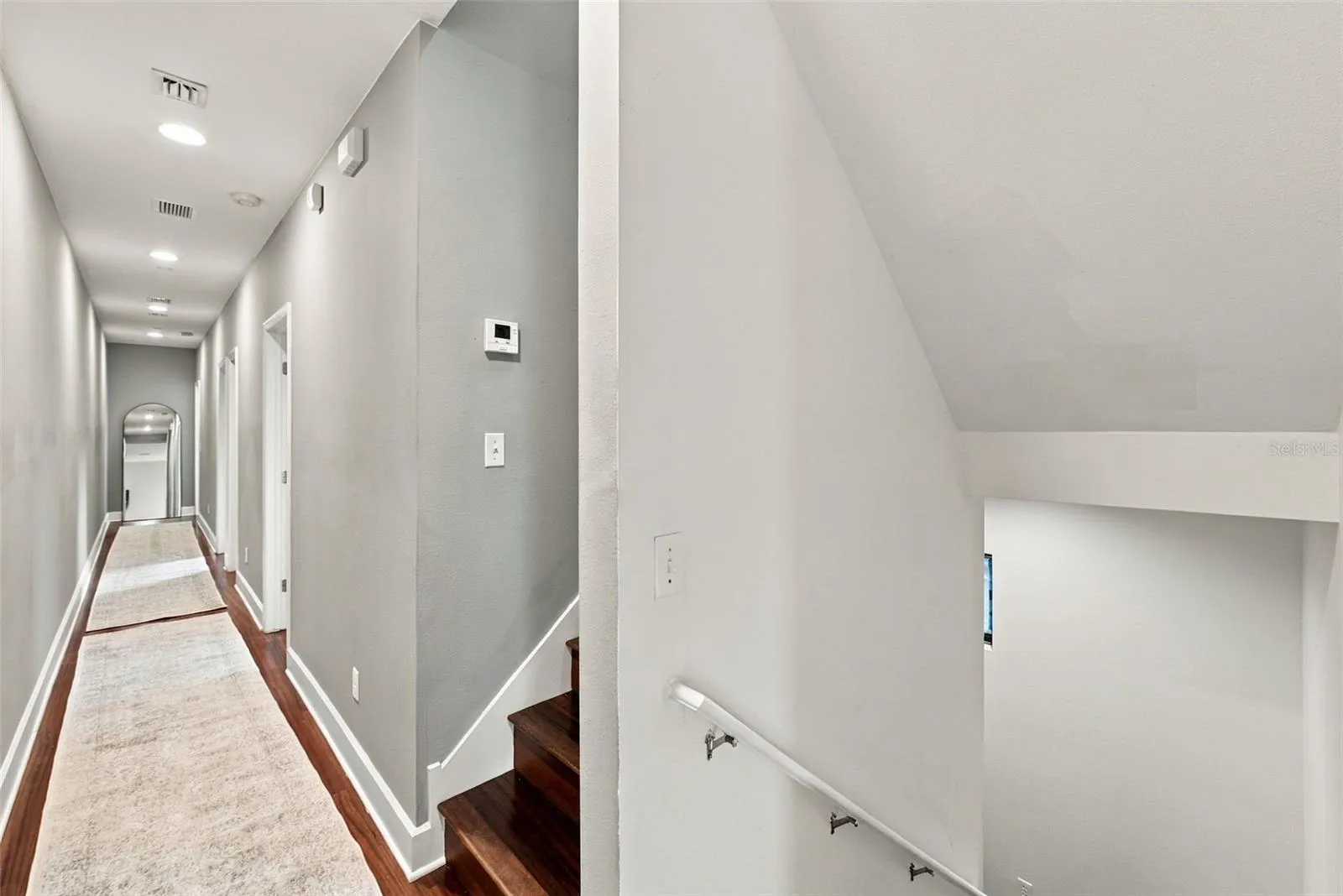 Down the hall are two secondary bedrooms and an office