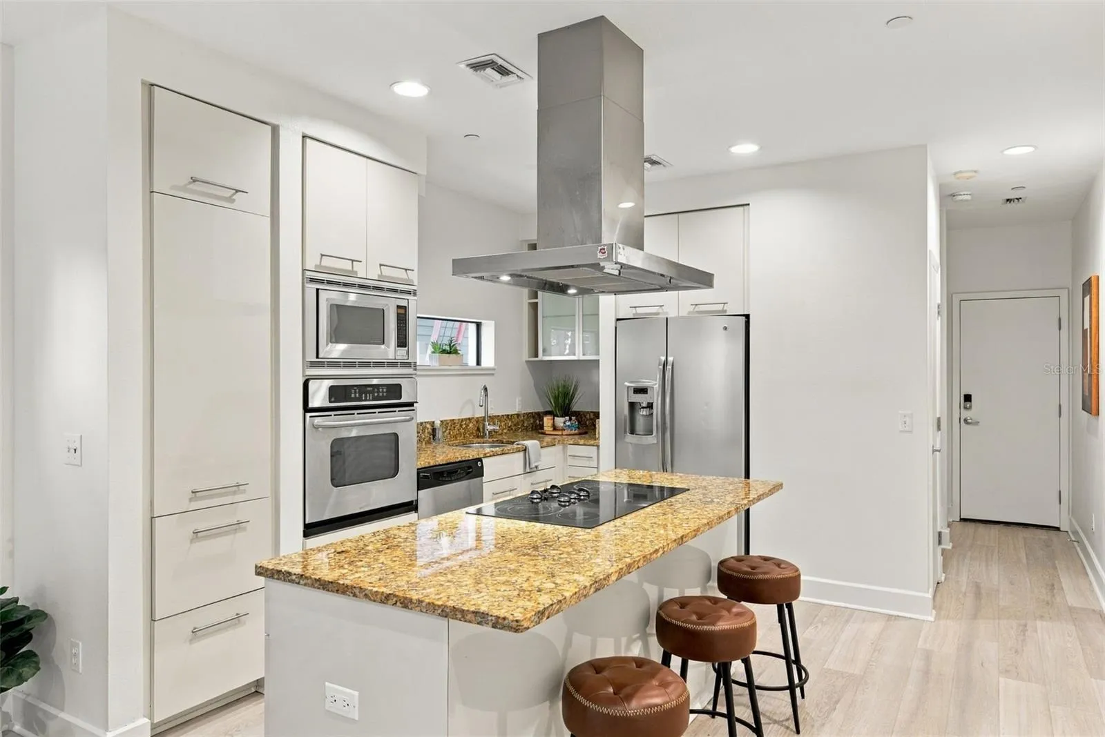 and opens to kitchen