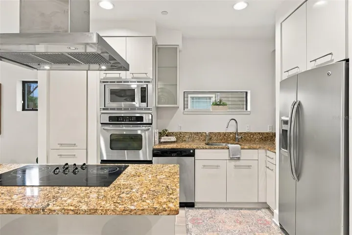 Kitchen features European cabinetry,