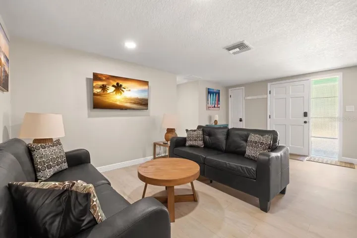 Bright, comfortable living space with LVP flooring and an easy flow into the rest of the home.