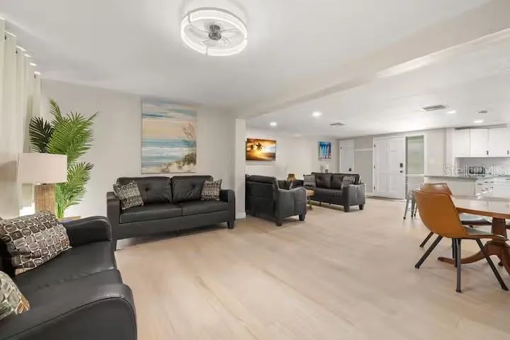 A second spacious living area adds valuable flexibility while maintaining the home’s open, connected feel.