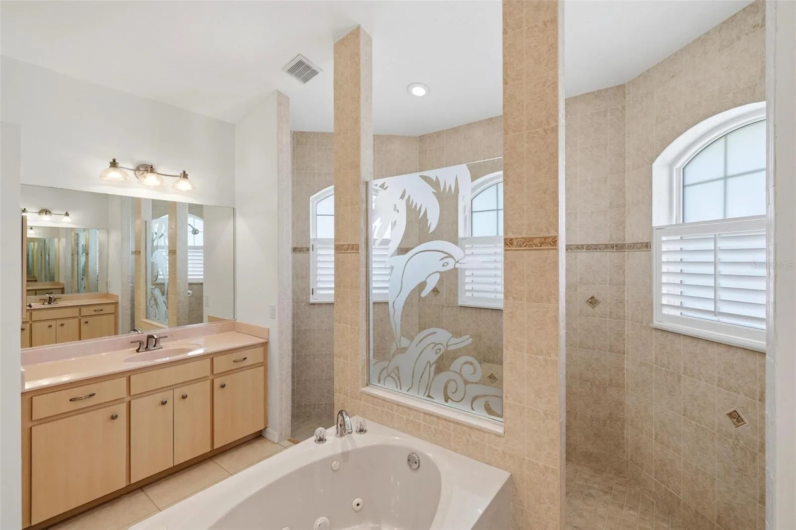 Primary Bathroom.... Split Vanities.. Plenty of cabinets for storage...