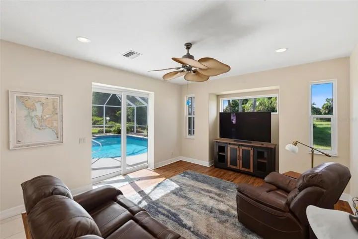 Family room with hurricane pocket sliding glass door out to the lanai/pool...