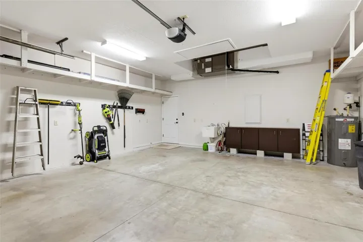 2 Car Garage with high storage shelves built-in...