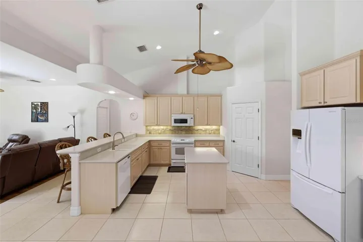 Kitchen with long breakfast bar....center island.... walk-in pantry closet...Lots of space...