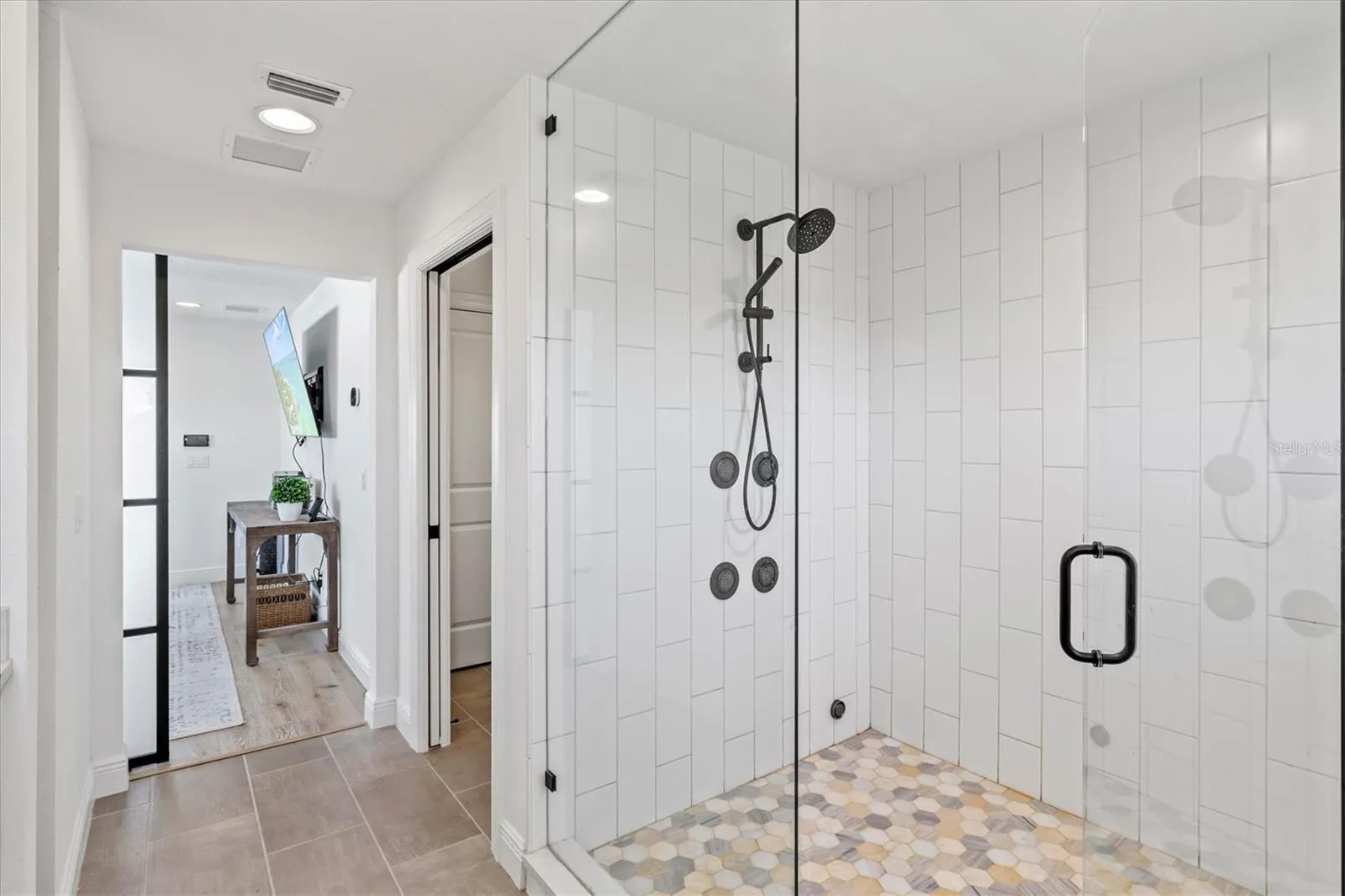 Primary suite bath with steam shower.