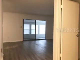 FAMILY ROOM TOWARD ENCLOSED PORCH
