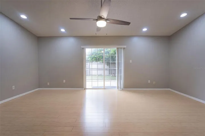 Great Room with recessed lights and vaulted ceilings
