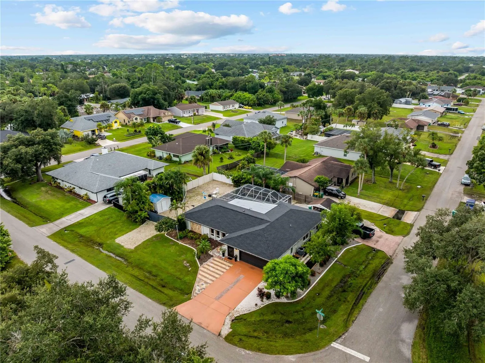 Note the 2 driveways and gravel parking pad on the left.  Superb landscaping.