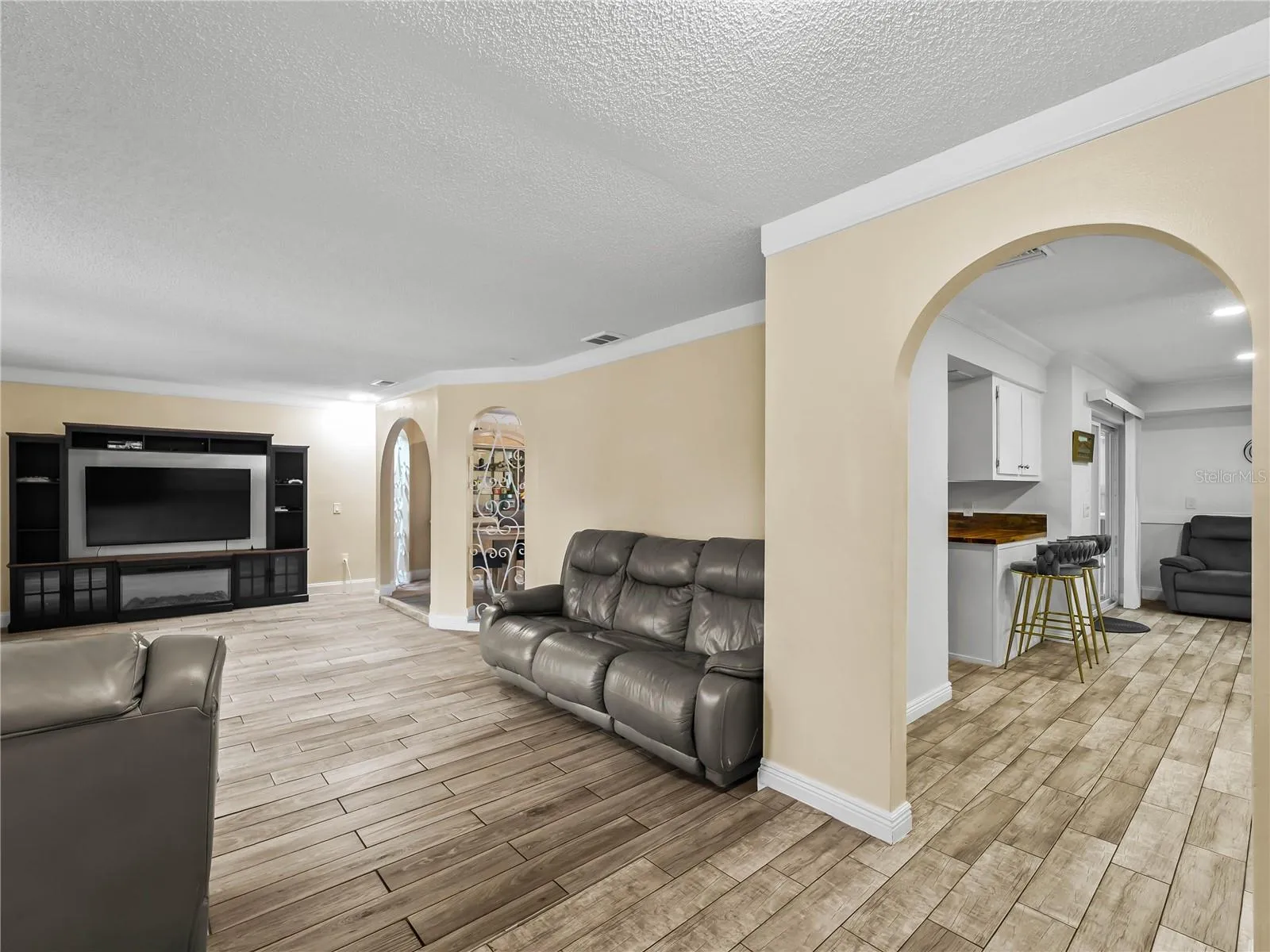View from the foyer: living room on the left, kitchen and family room on the right.