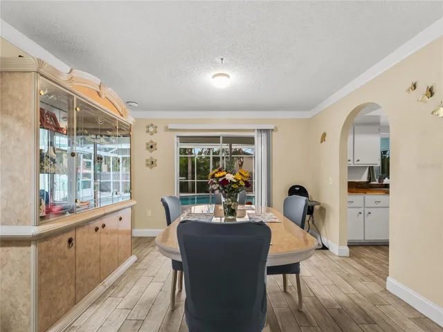 Dining room looking towards the SLD to the pool area.  Kitchen on the right.