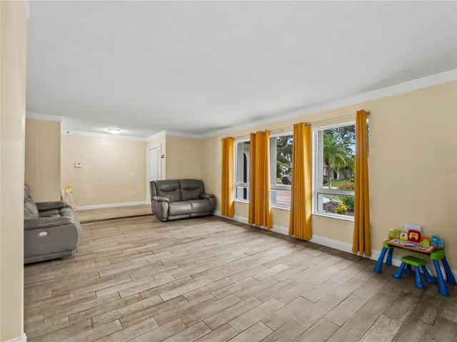 Living room looking back towards the foyer.  Ample natural light.