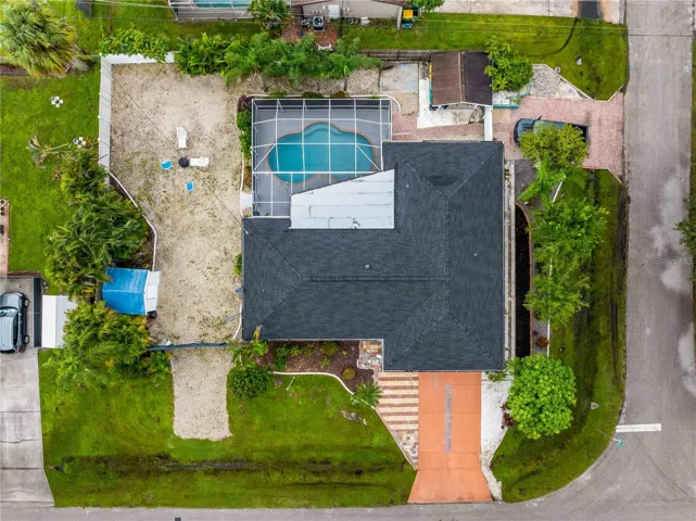 Ample driveway parking, vehicle access to the shed off Atlas St., and plenty of room for boat or RV on the left side.