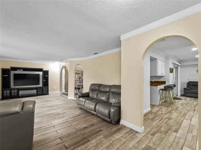 View from the foyer: living room on the left, kitchen and family room on the right.