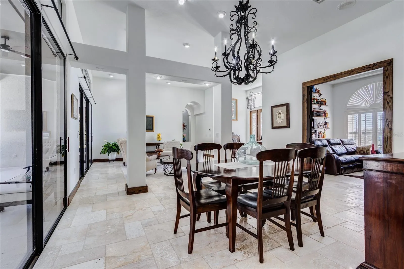 Dining area with sliders that lead to pool!