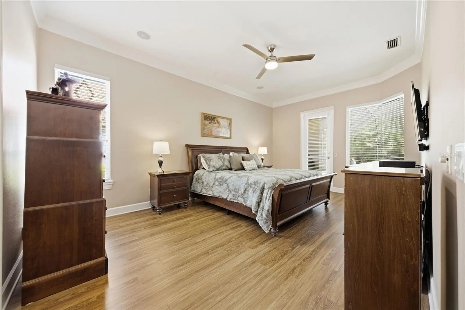 Primary bedroom overlooks pool