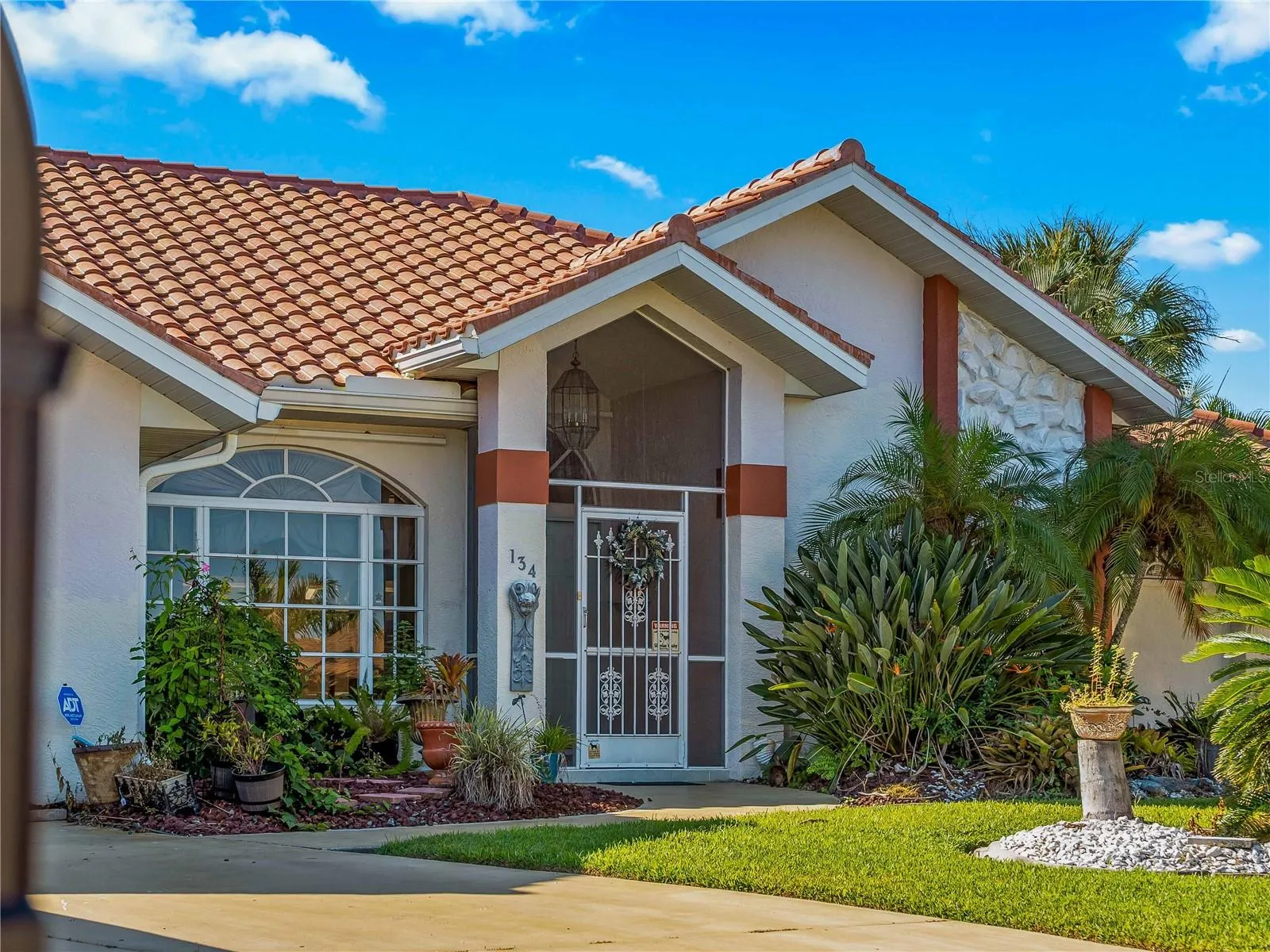 FrontExterior_134TocopillaStreet_PuntaGorda_Landscaped_Entry.jpg