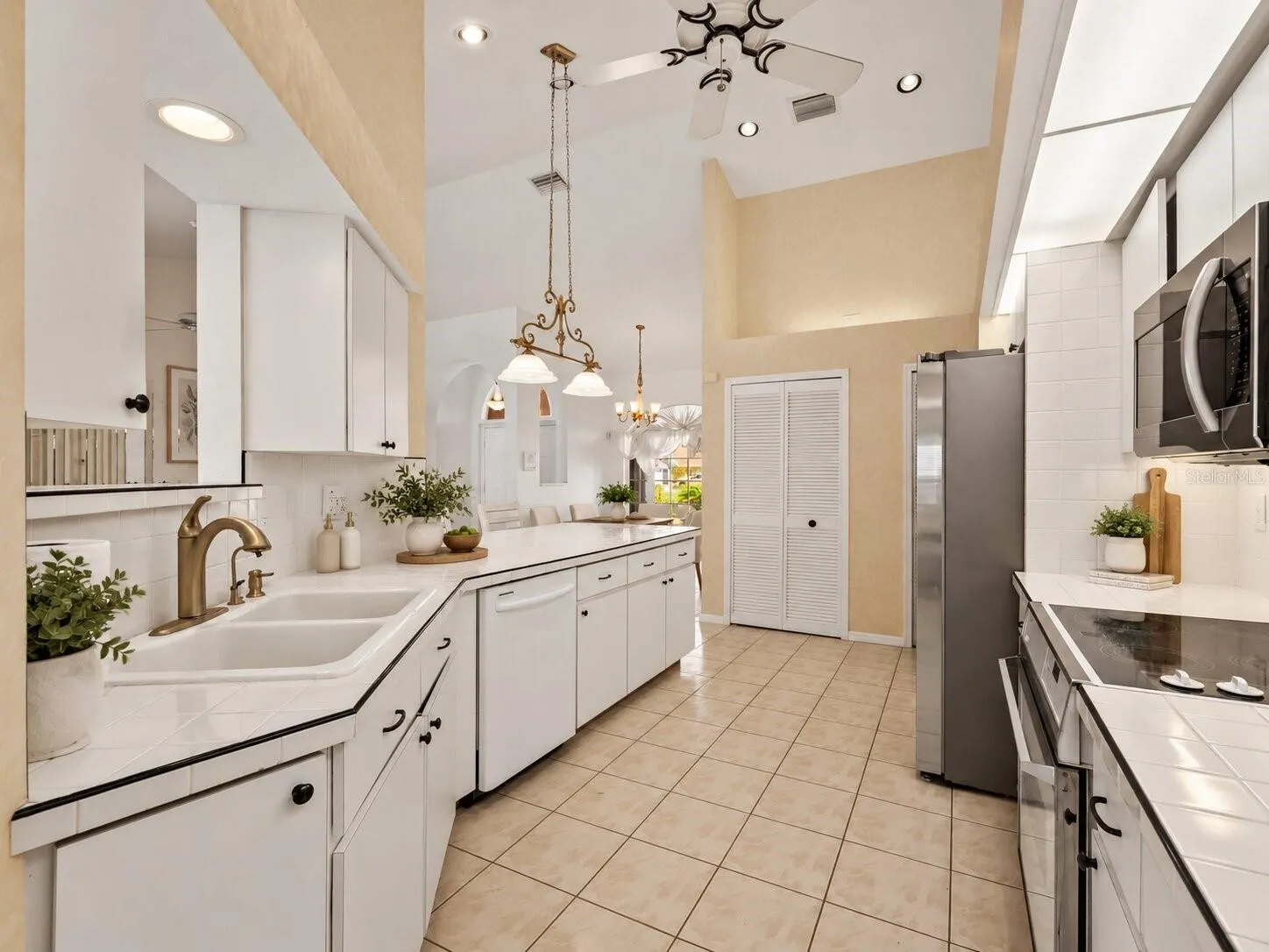 (Staged) Kitchen_134TocopillaStreet_PuntaGorda_WhiteCabinetry_Corner.jpg