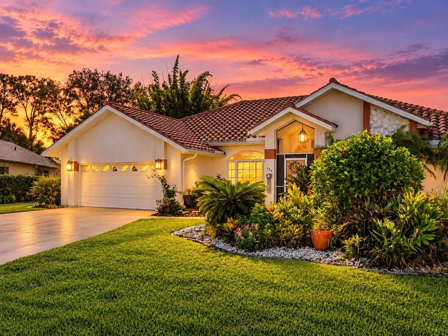 FrontExterior_134TocopillaStreet_PuntaGorda_CurbAppeal_Twilight.jpg