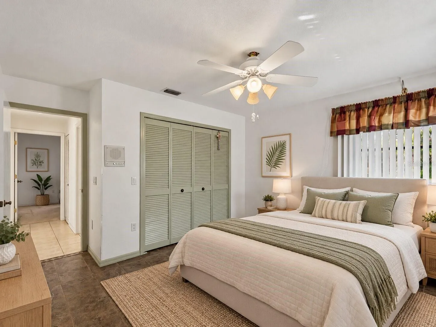(Staged) Bedroom_134TocopillaStreet_PuntaGorda_NaturalLight_Corner.jpg