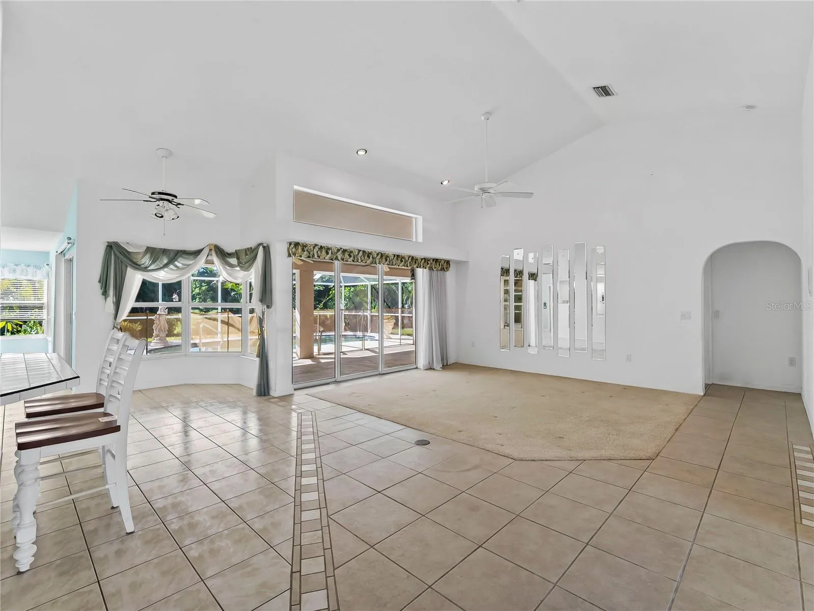 DiningLiving_134TocopillaStreet_PuntaGorda_OpenConcept_SliderView.jpg