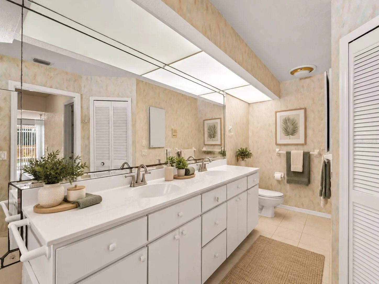 (Staged) Bath_134TocopillaStreet_PuntaGorda_DoubleVanity_Corner.jpg