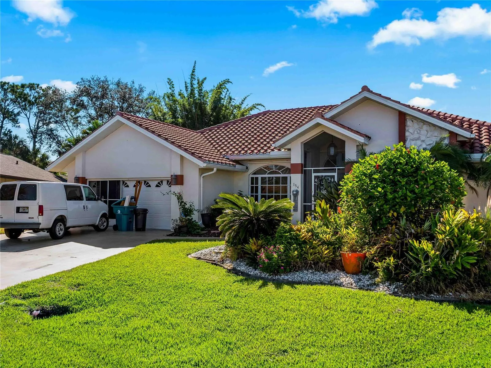 FrontExterior_134TocopillaStreet_PuntaGorda_Landscaped_Daylight.jpg