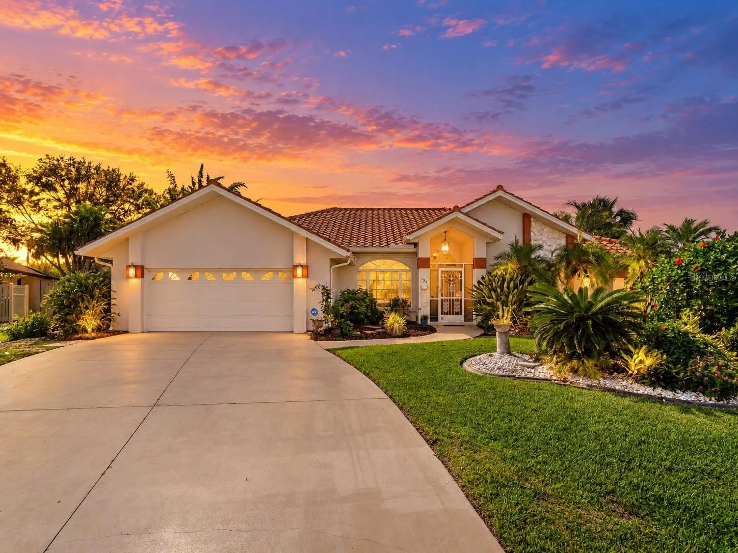 FrontExterior_134TocopillaStreet_PuntaGorda_Landscaped_Daylight.jpg