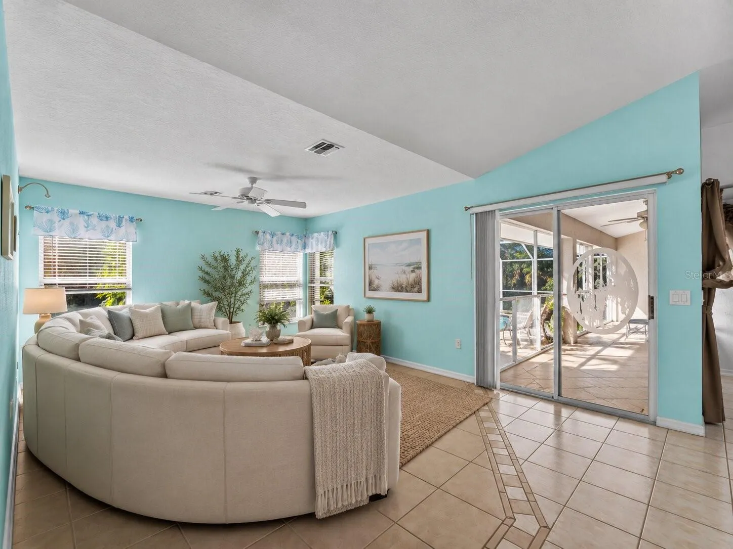 (Staged) FamilyRoom_134TocopillaStreet_PuntaGorda_OpenConcept_SliderView.jpg