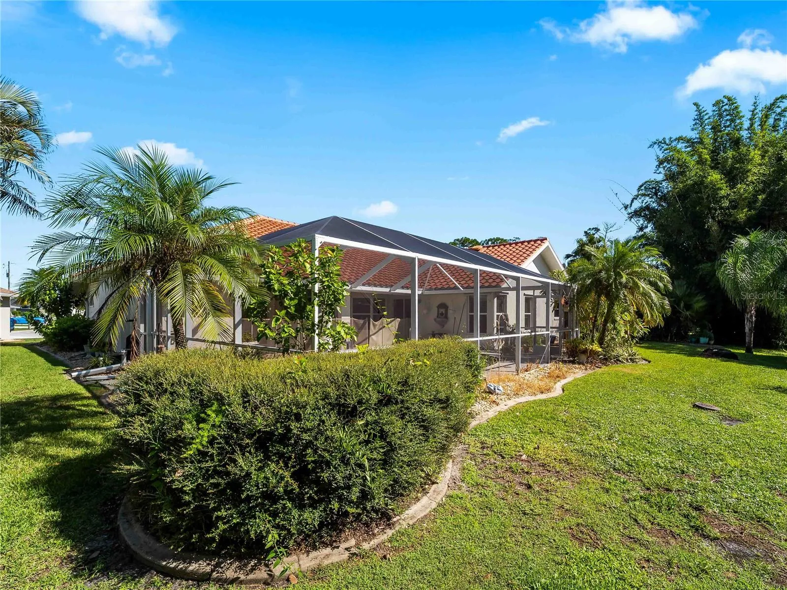 RearExterior_134TocopillaStreet_PuntaGorda_Landscaped_Daylight.jpg