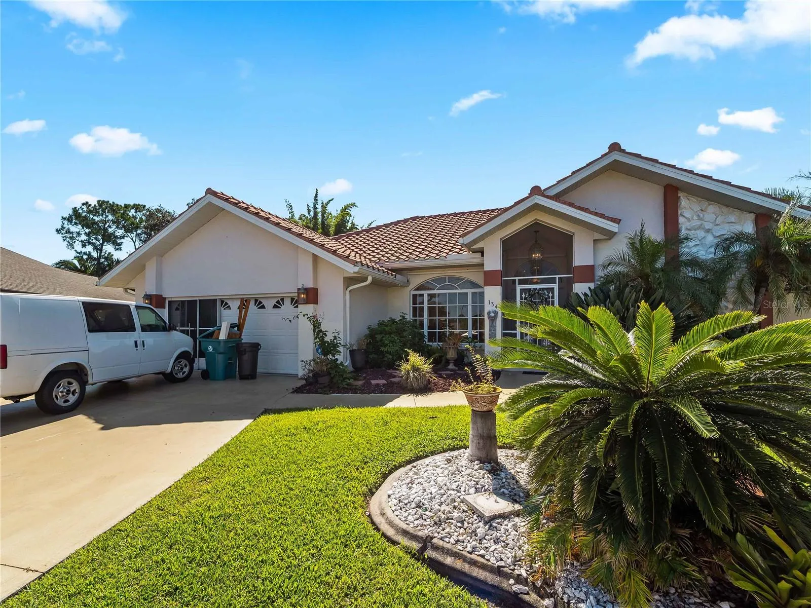 FrontExterior_134TocopillaStreet_PuntaGorda_TropicalLandscaping_Corner.jpg