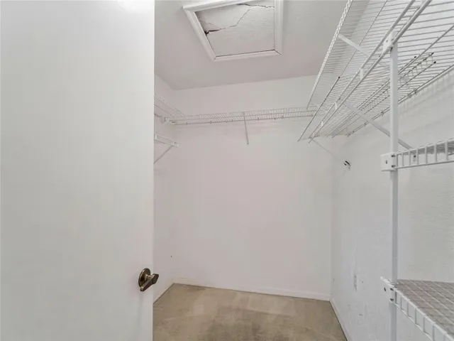 WalkInCloset_134TocopillaStreet_PuntaGorda_BuiltInShelving_Corner.jpg