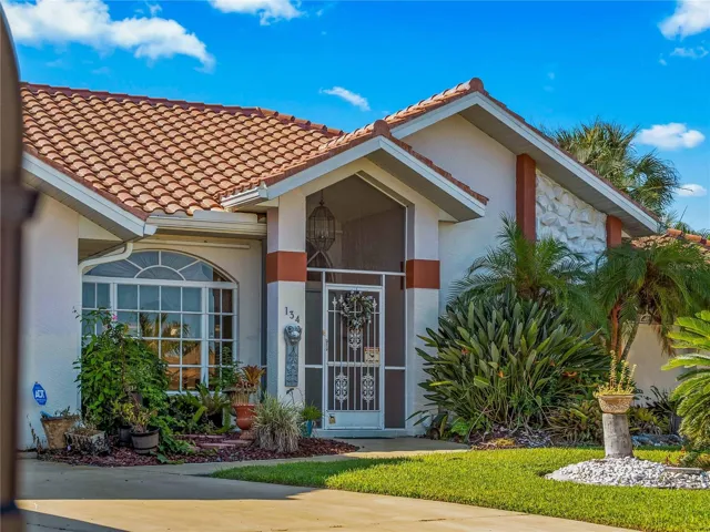 FrontExterior_134TocopillaStreet_PuntaGorda_Landscaped_Entry.jpg