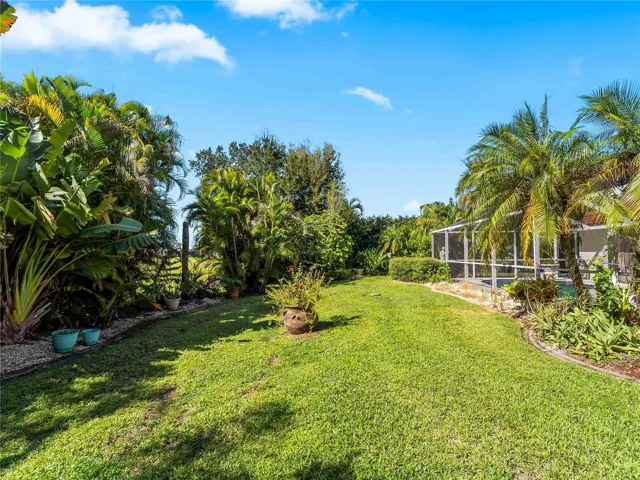 Backyard_134TocopillaStreet_PuntaGorda_SpaciousLawn_Daylight.jpg
