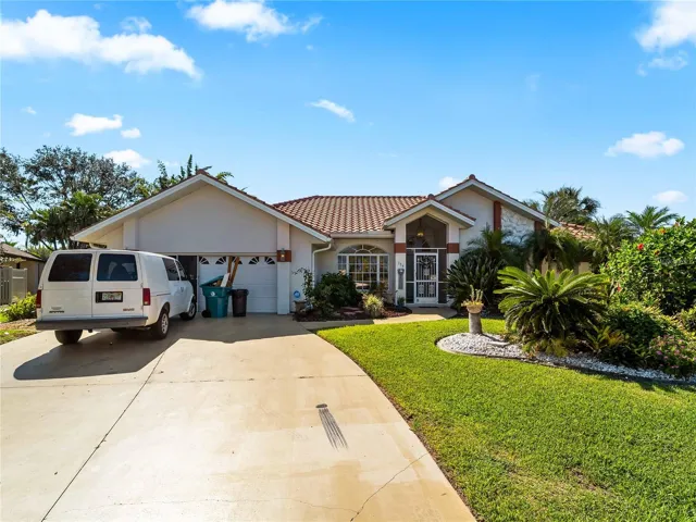 FrontExterior_134TocopillaStreet_PuntaGorda_CurbAppeal_Daylight.jpg