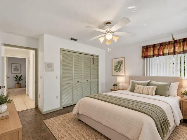(Staged) Bedroom_134TocopillaStreet_PuntaGorda_NaturalLight_Corner.jpg