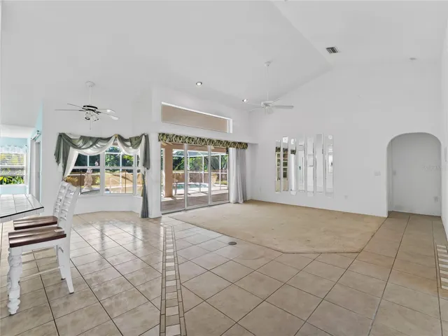 DiningLiving_134TocopillaStreet_PuntaGorda_OpenConcept_SliderView.jpg