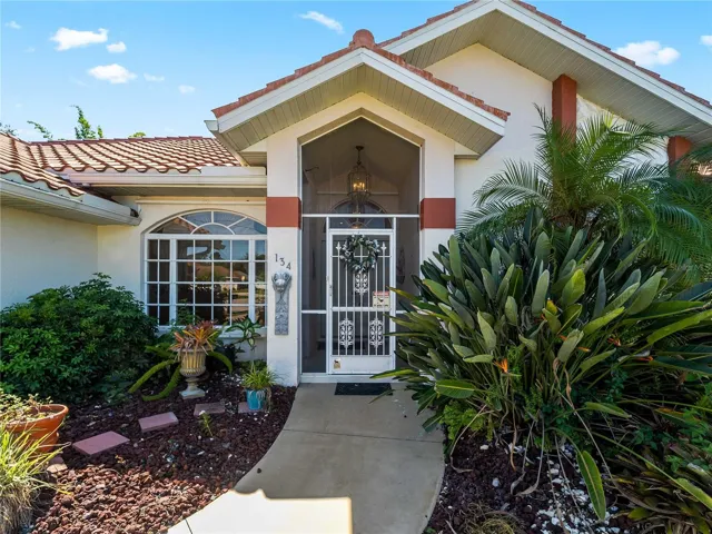 FrontExterior_134TocopillaStreet_PuntaGorda_Landscaped_Entry.jpg