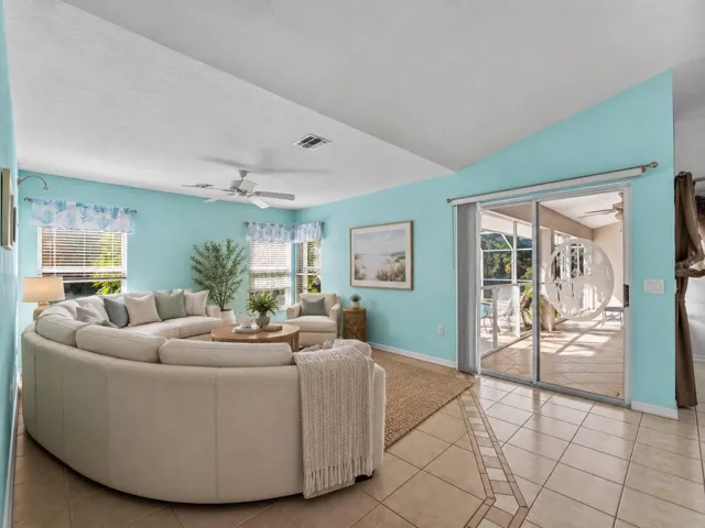 (Staged) FamilyRoom_134TocopillaStreet_PuntaGorda_OpenConcept_SliderView.jpg