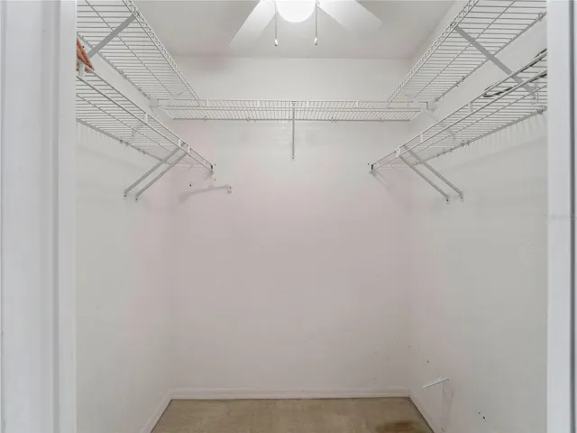 WalkInCloset_134TocopillaStreet_PuntaGorda_BuiltInShelving_Entry.jpg