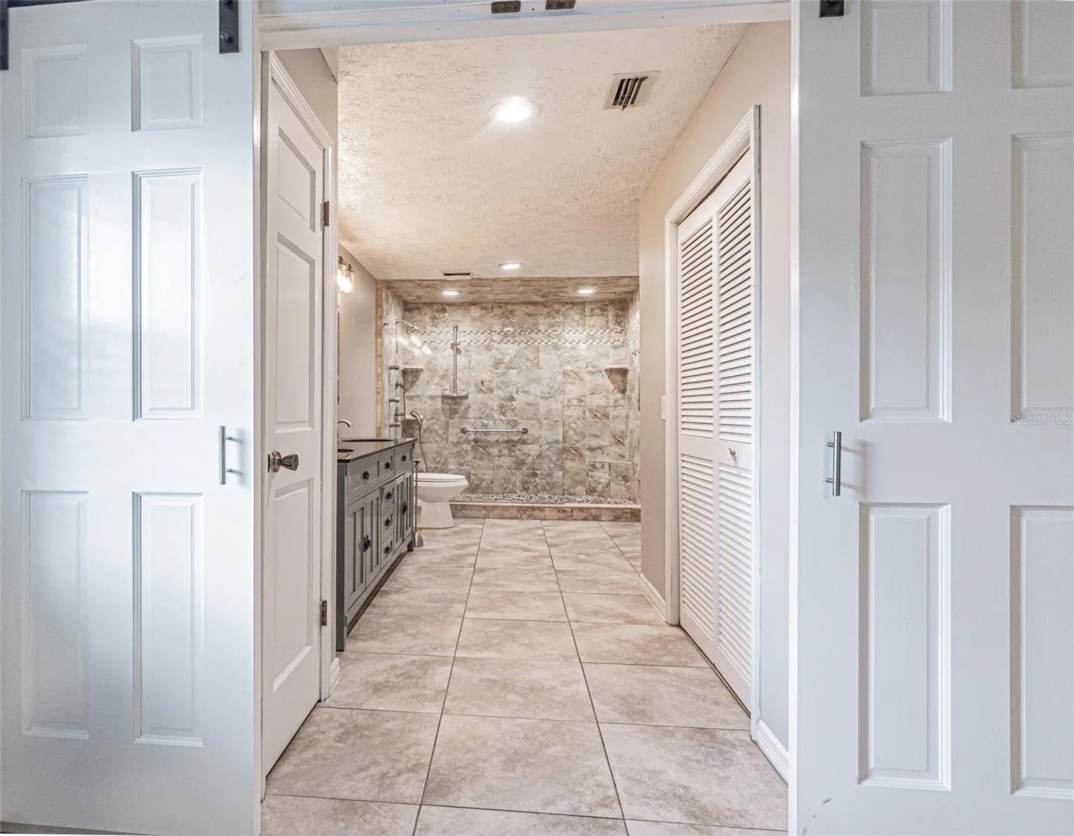 primary bath with sliding doors