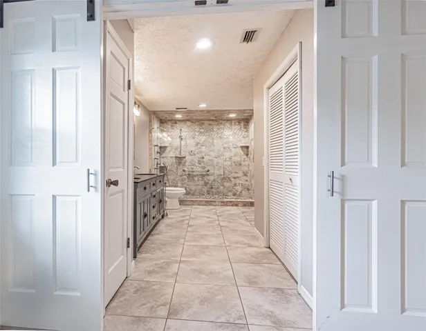 primary bath with sliding doors